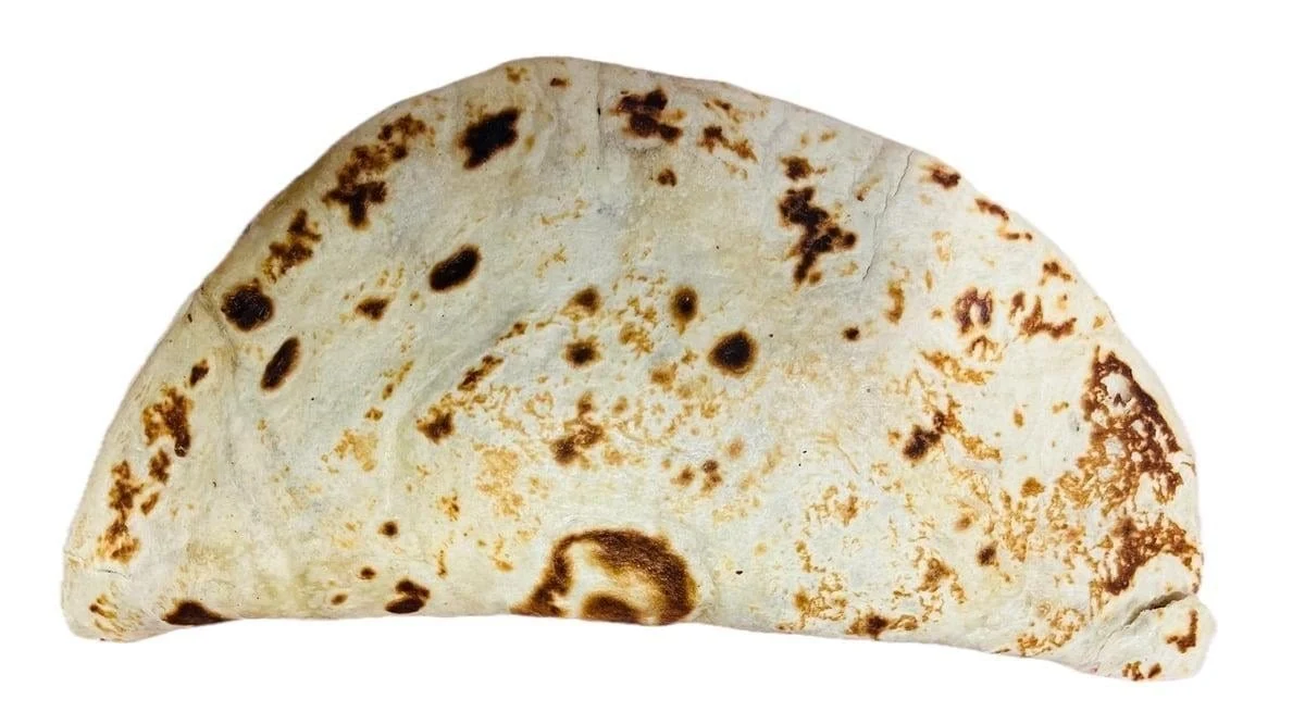 Baleada Sencilla Mas Aguacate - Simple baleada with refried beans, cheese, cream, and fresh avocado.