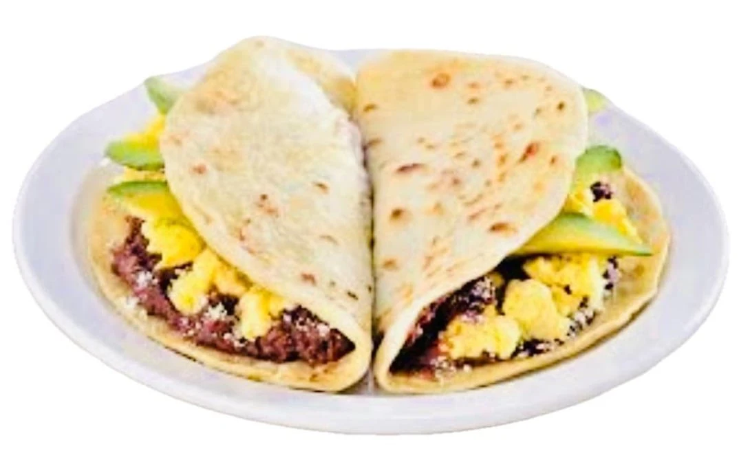Baleada Sencilla Mas Carne - Simple baleada with refried beans, cheese, cream, and savory meat.
